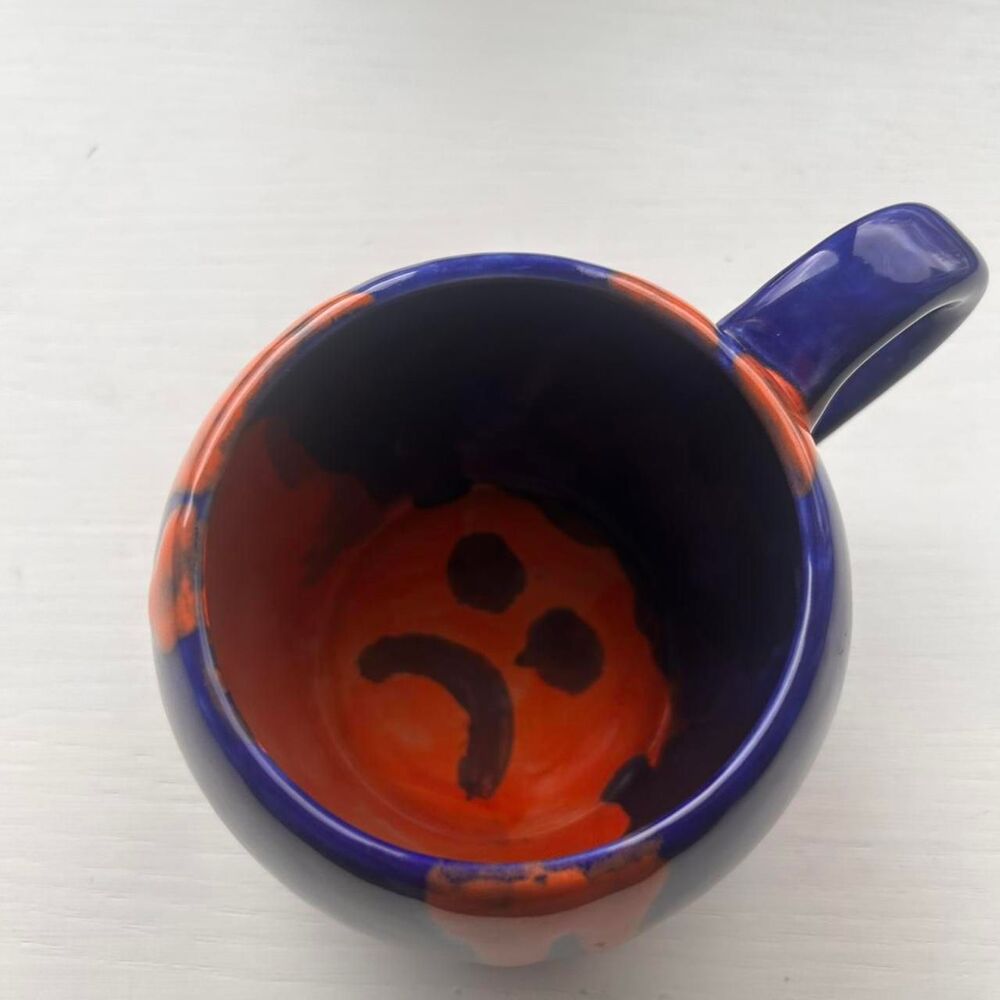 Handcrafted large clay mug‎ with sad face blue/Orange
